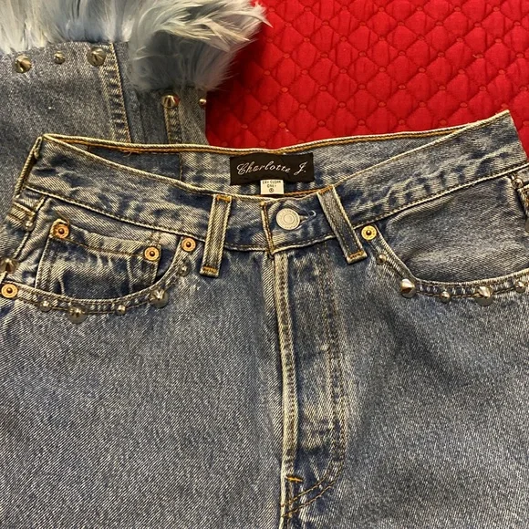 Vintage Levi’s redesign by Charlotte f with real feather detail o de legs sides